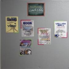 Photo of grey school bulletin board with notices about book club on it.