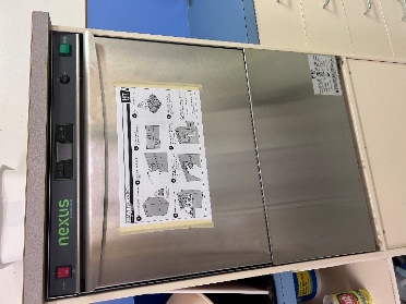A dishwasher with a label on it
Description automatically generated