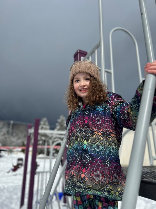A child climbing a playground
Description automatically generated