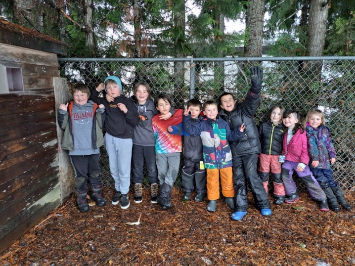 A group of children posing for a photo
Description automatically generated