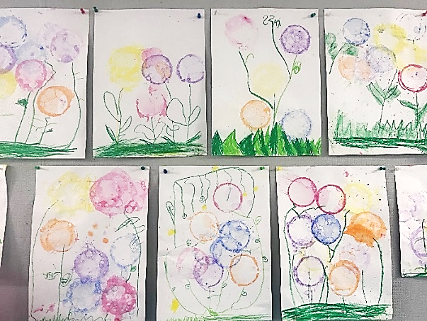 A group of children's drawings
Description automatically generated