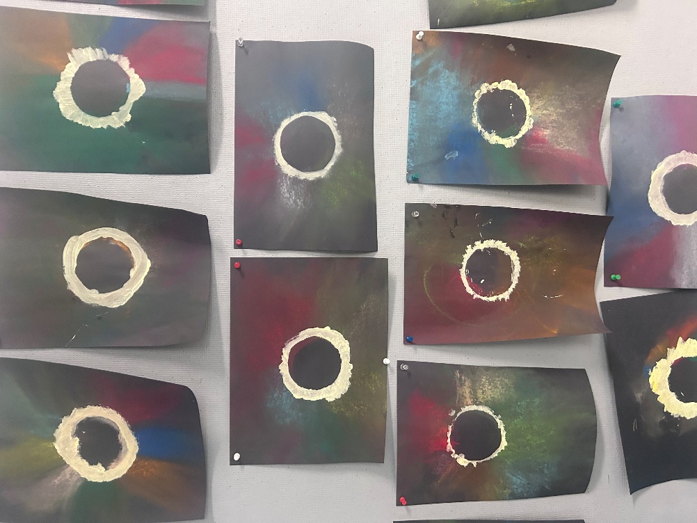 A group of black rectangles with white circles
Description automatically generated